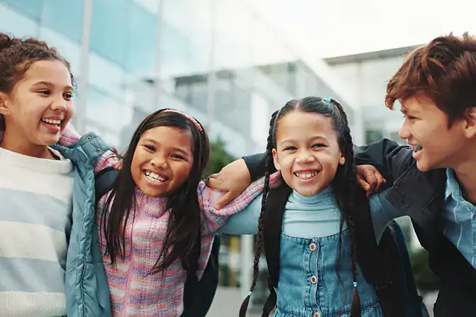 Children happily headed back to school, representing financial learning and student accounts.