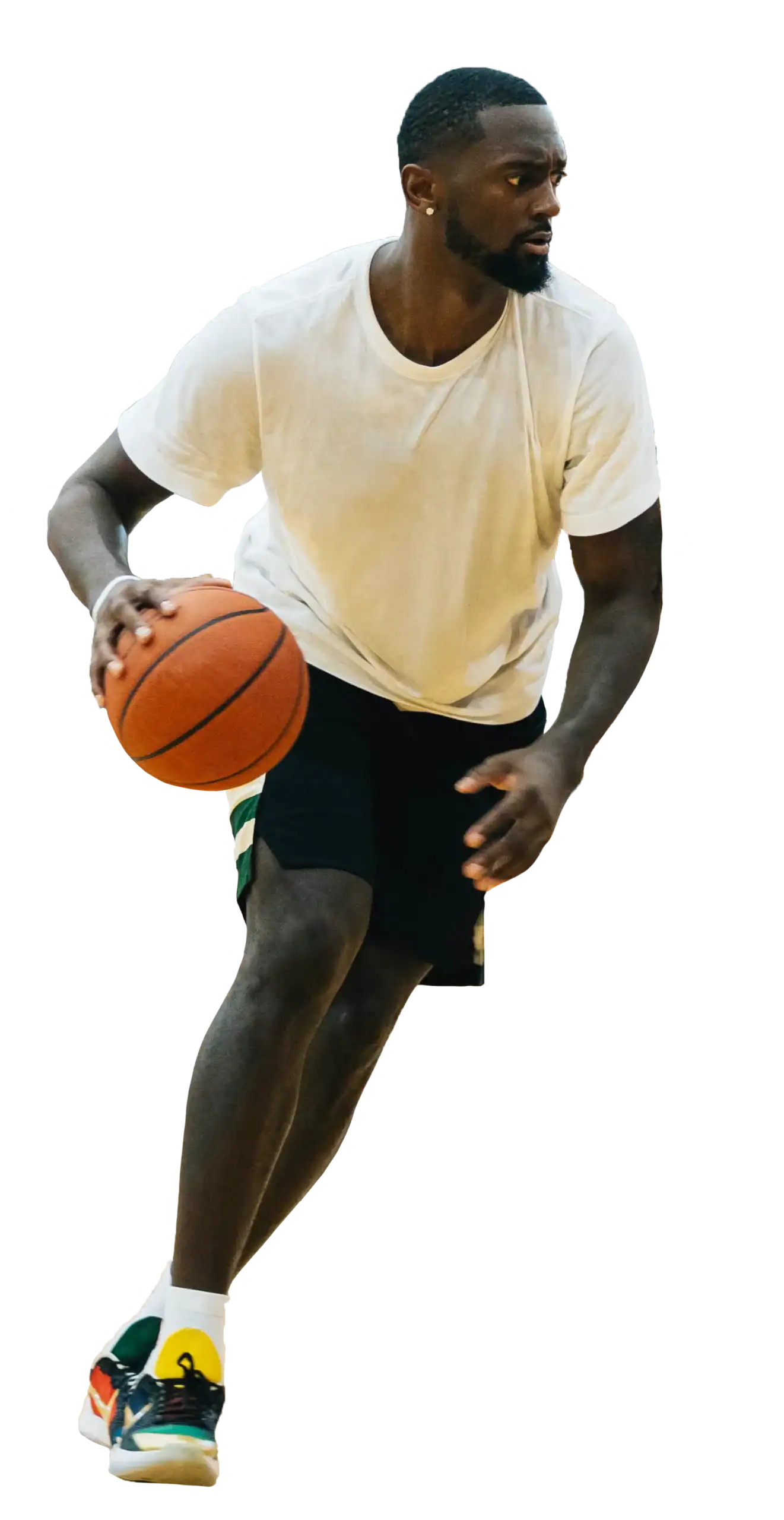 Milwaukee basketball player in white shirt dribbling ball during game.