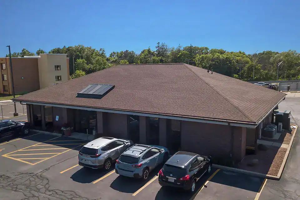 Exterior view of the Glendale branch with parking lot and solar panels.