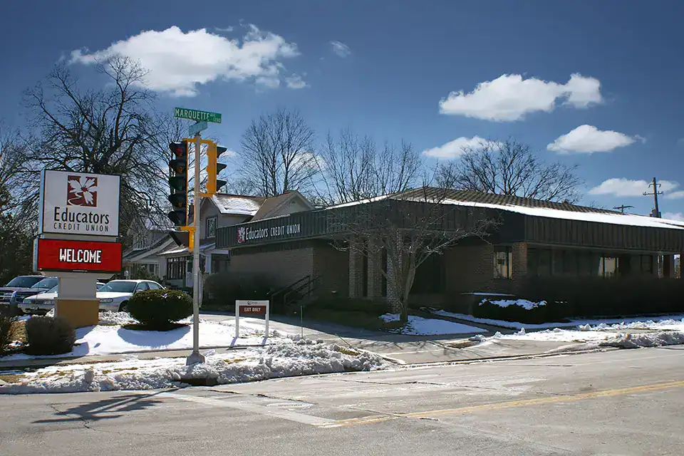 Exterior view of the South Milwaukee branch in winter with snow and clear sky.