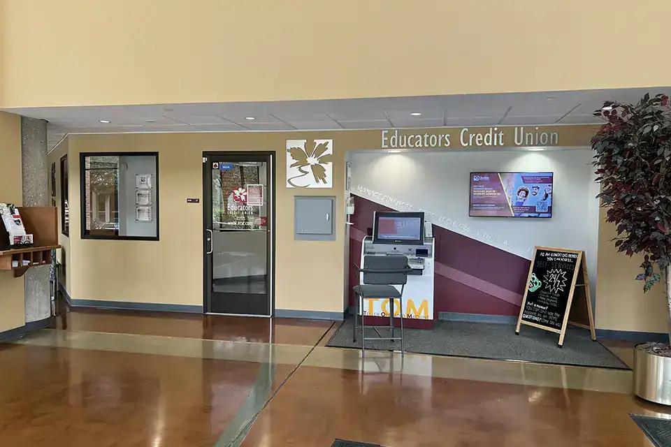 Interior view of the UW Parkside Branch with ATM and signage.