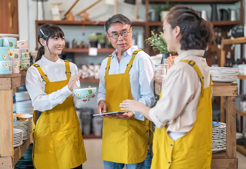 Friendly employees working together on business solutions and strategies.
