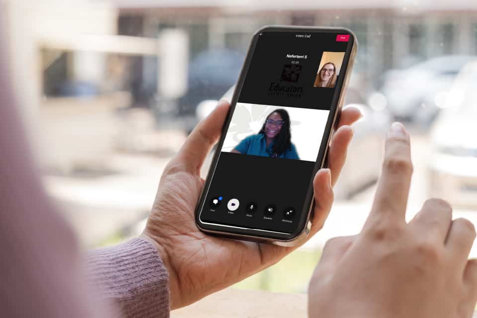 member talking to Educators Connect Cam staff member