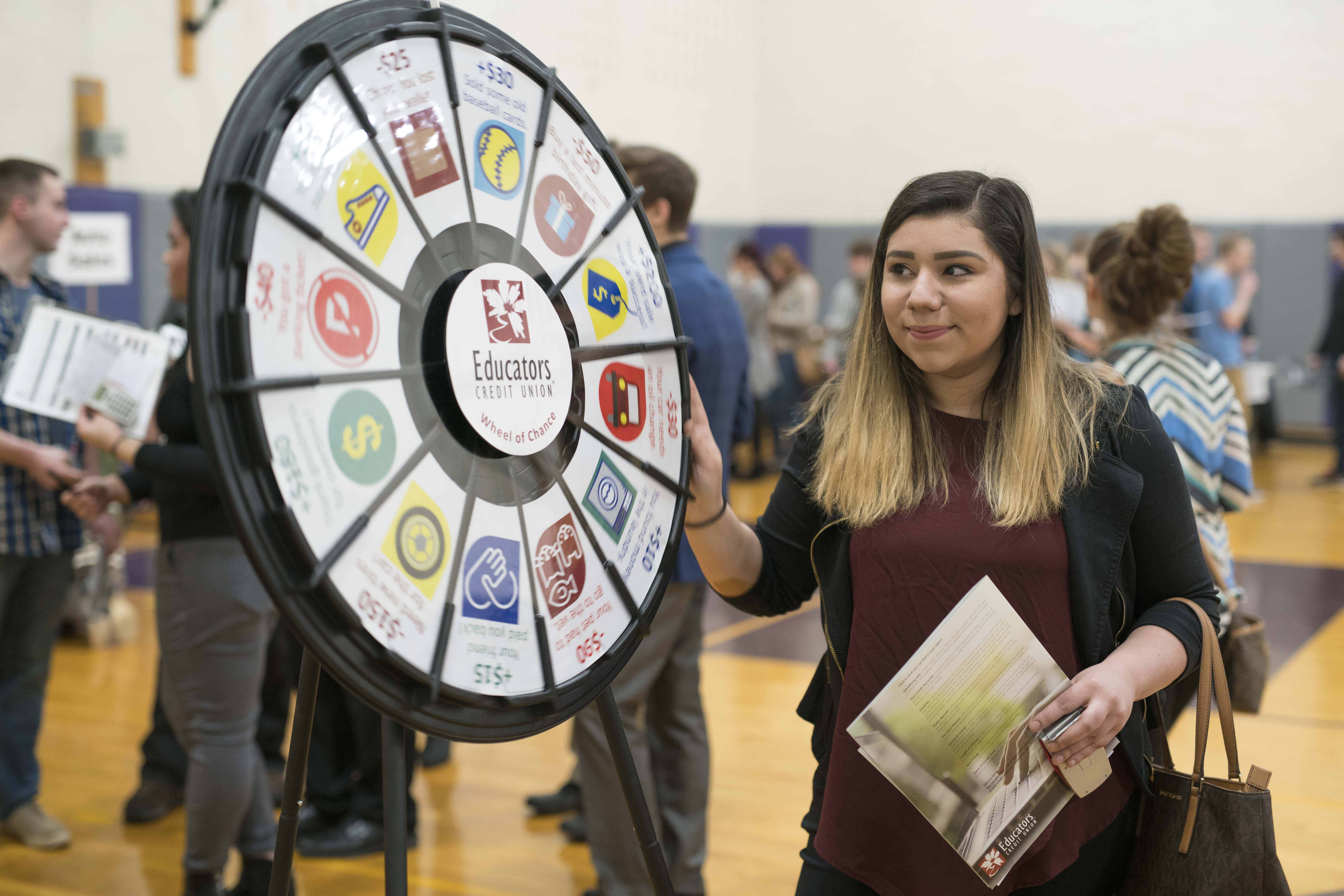 Reality Check Day student from Cudahy High School spinning the wheel of fate