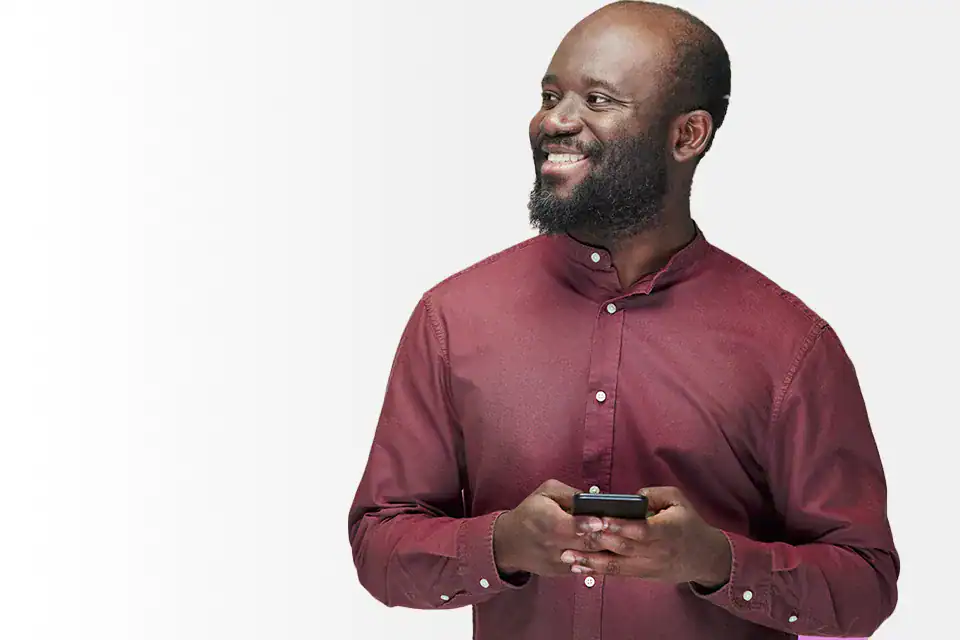 Happy man using smartphone, representing digital services and self-service.