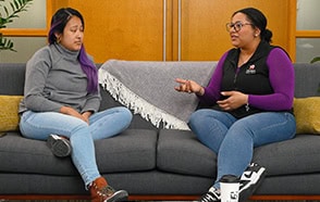 Two employees having a meaningful Flower Power discussion.