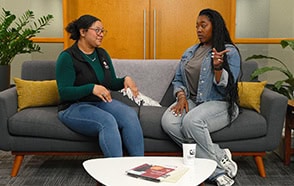 Two employees having a Flower Power session in an office setting.