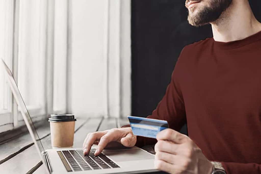 Man using credit card online