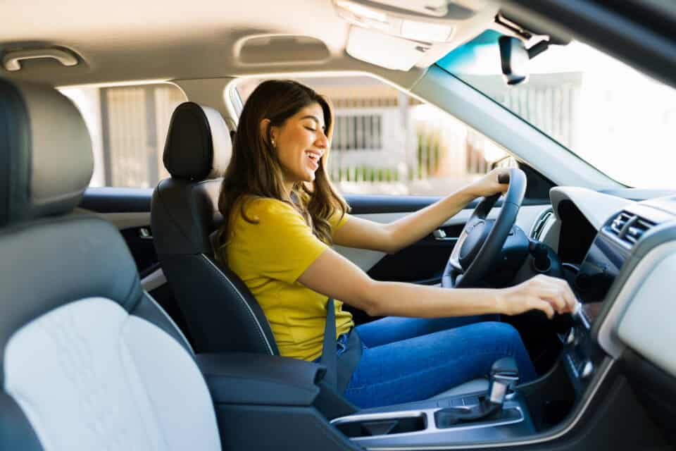 woman driving new car