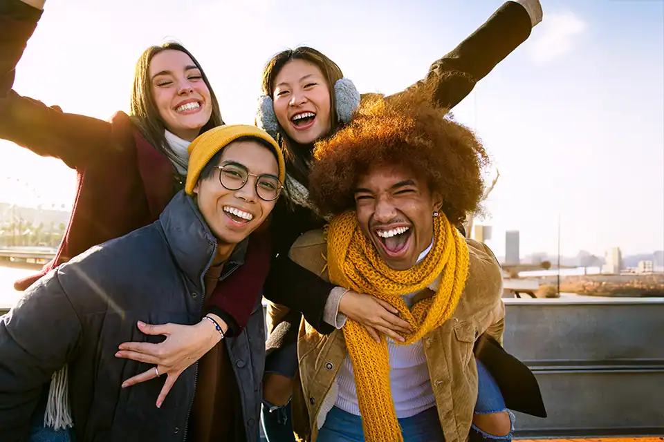 group of young adults achieving more together