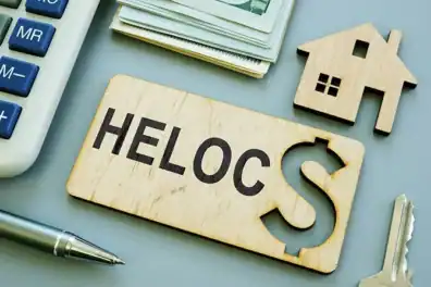 HELOC loan concept with house, dollar sign, and office supplies.