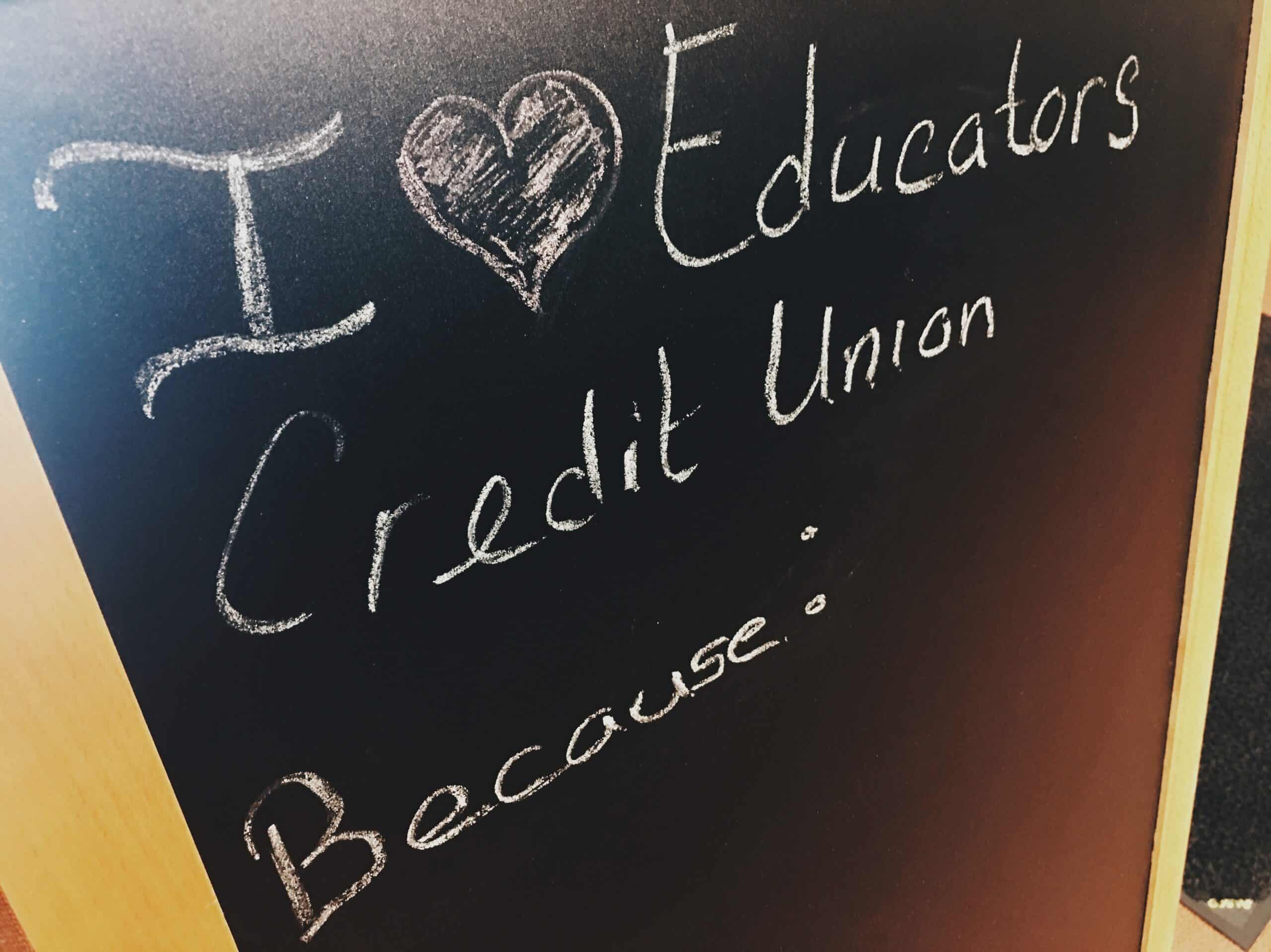 Chalk board with writing saying: "I Love Educators Credit Union Because:"