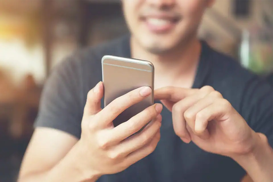 Man reading newsletter on phone