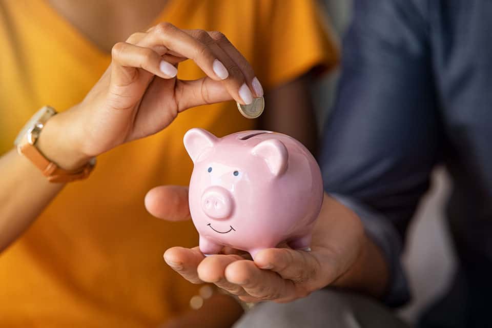 couple holding piggy bank