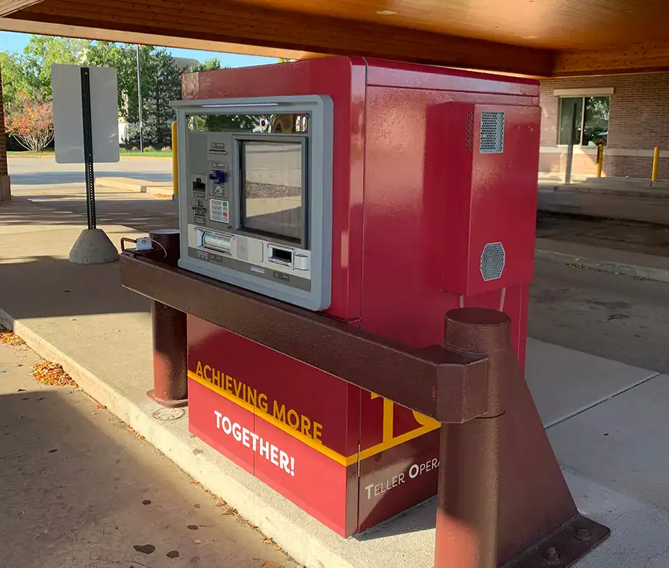Red TOM at a branch drive-thru used for banking services.
