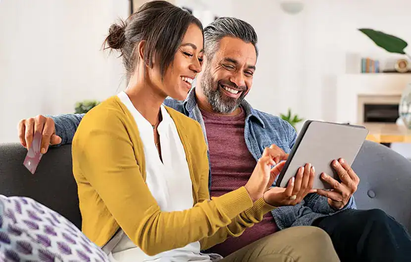 Couple using tablet to speak with agent on Connect Cam