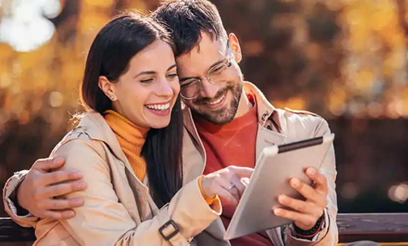 Couple banking on their mobile tablet.