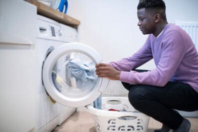 boy doing laundry earning money for mind & money
