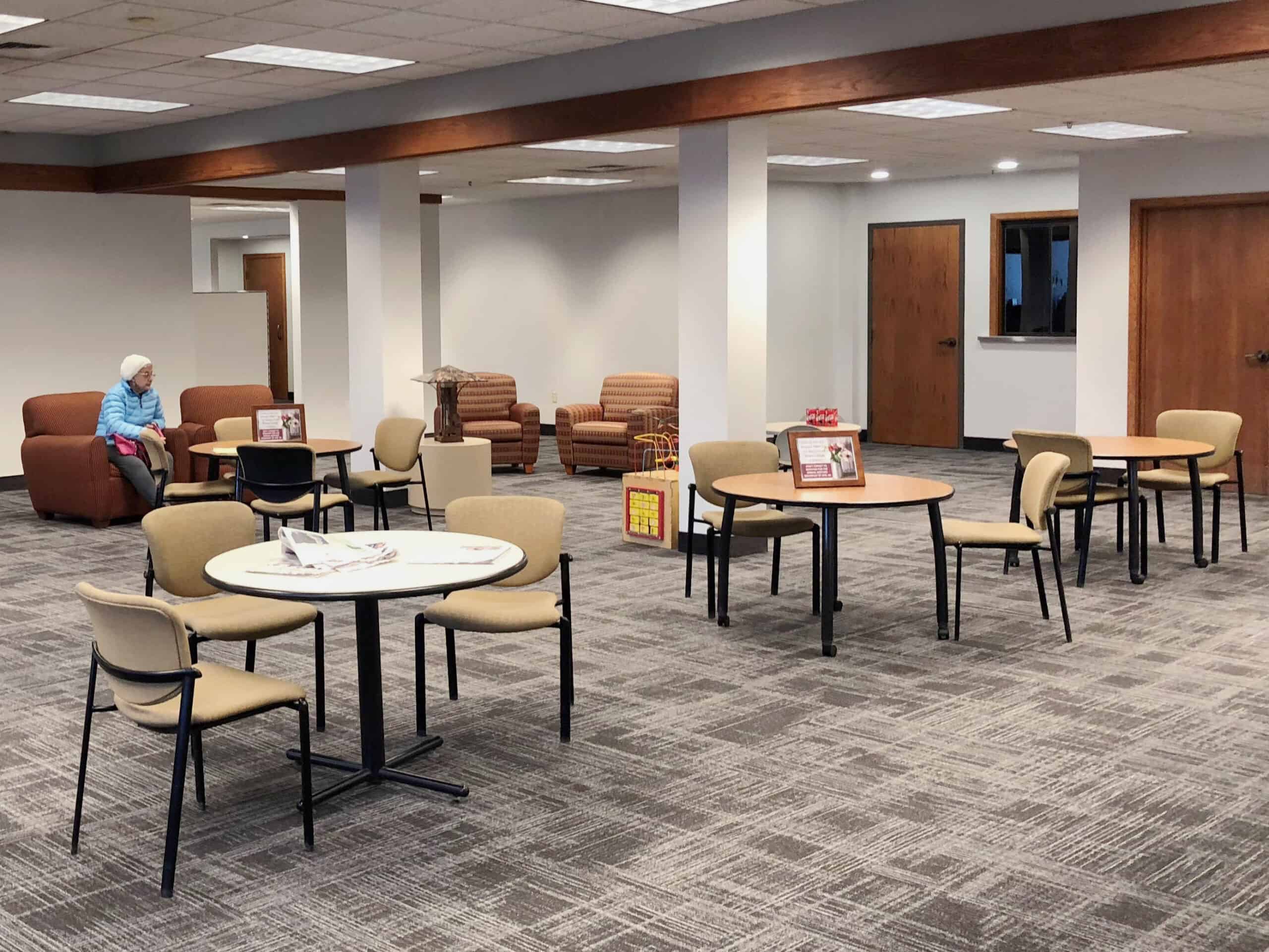 updated newman office space with tables and chairs for members