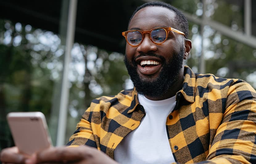 Young man using mobile banking on his phone.