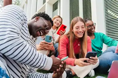 Teens with student accounts using their account on mobile banking on their device