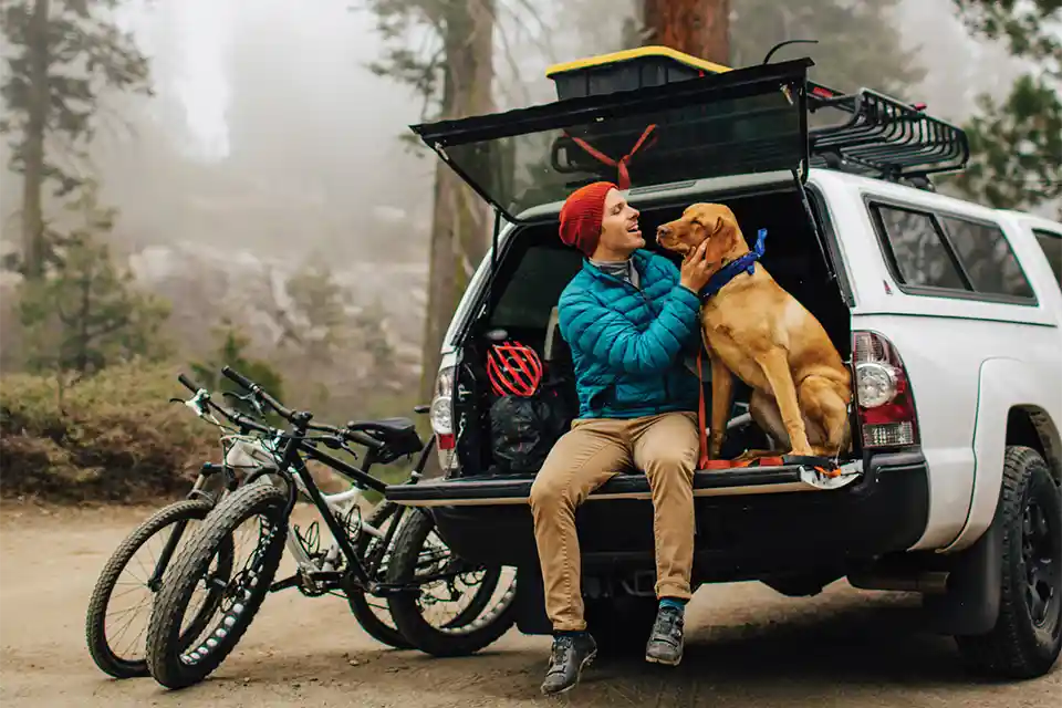 Adventure with dog and man outdoors.
